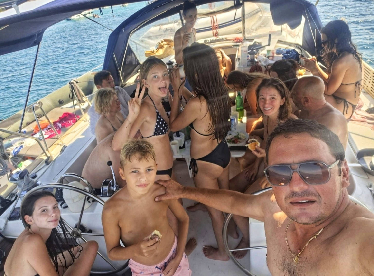 Family and friends enjoying time together aboard a yacht