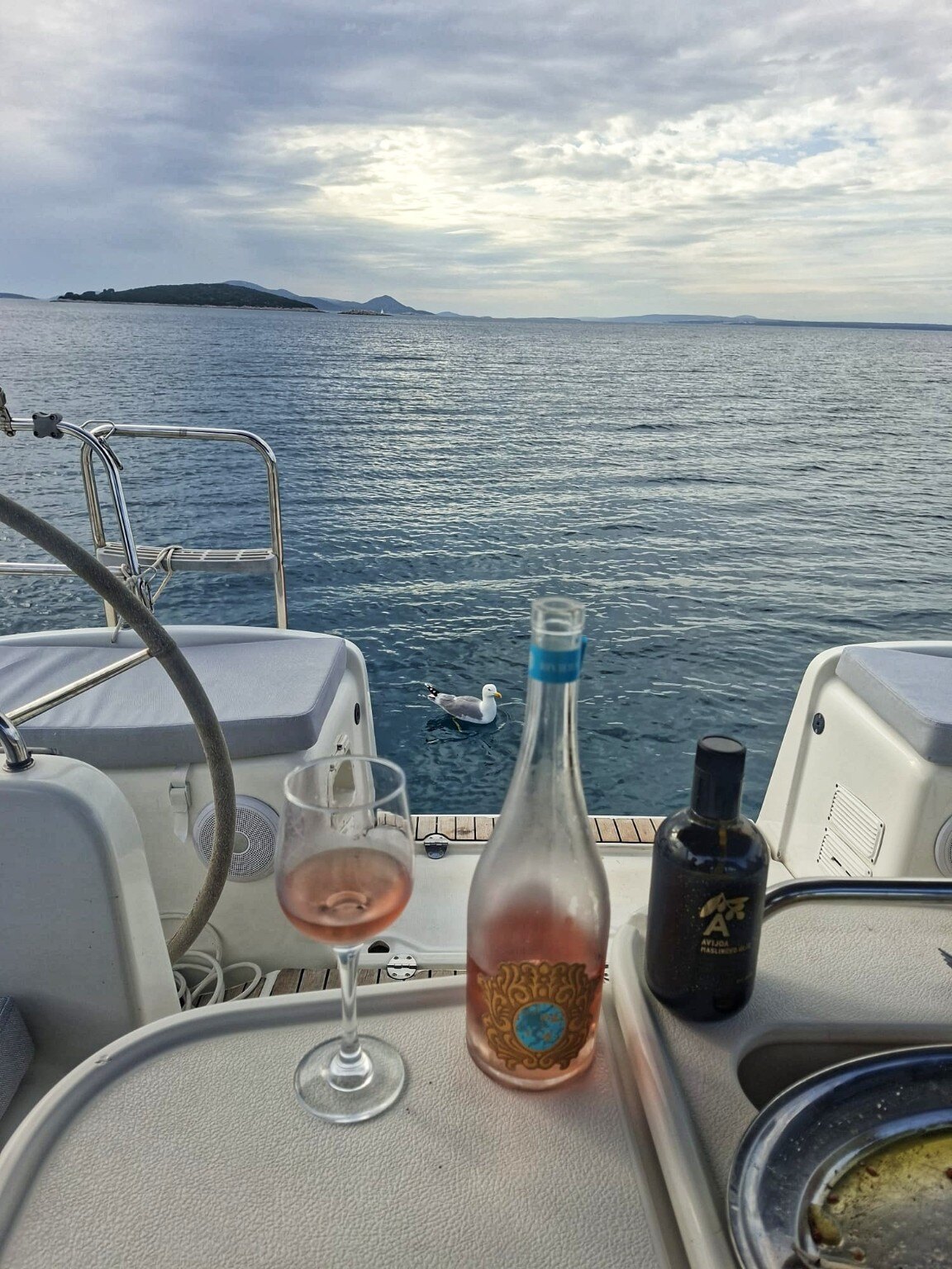 Local wine and a calm sea view from the cockpit