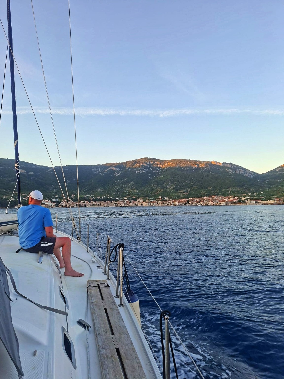 Sailing toward a coastal Croatian town at sunset