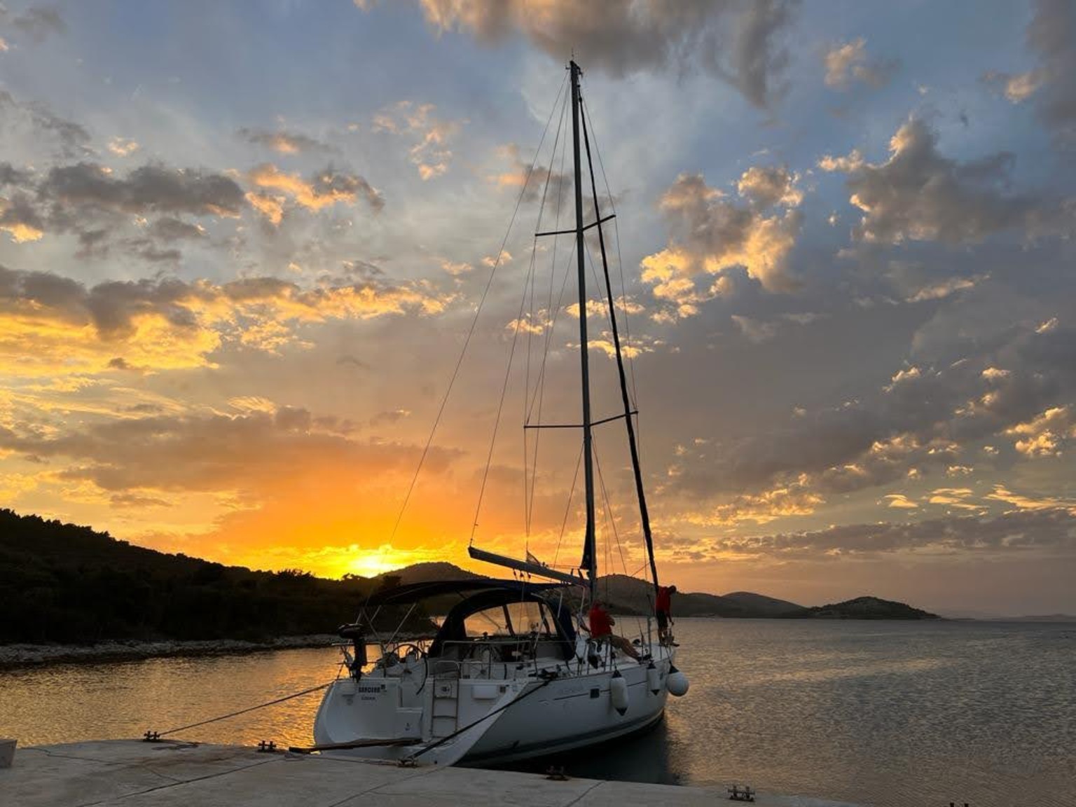 Sailing yacht beneath a golden Adriatic sunset